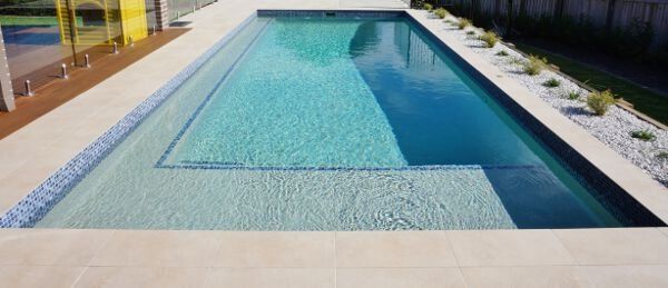 Custom concrete pool by Sundollar Pools